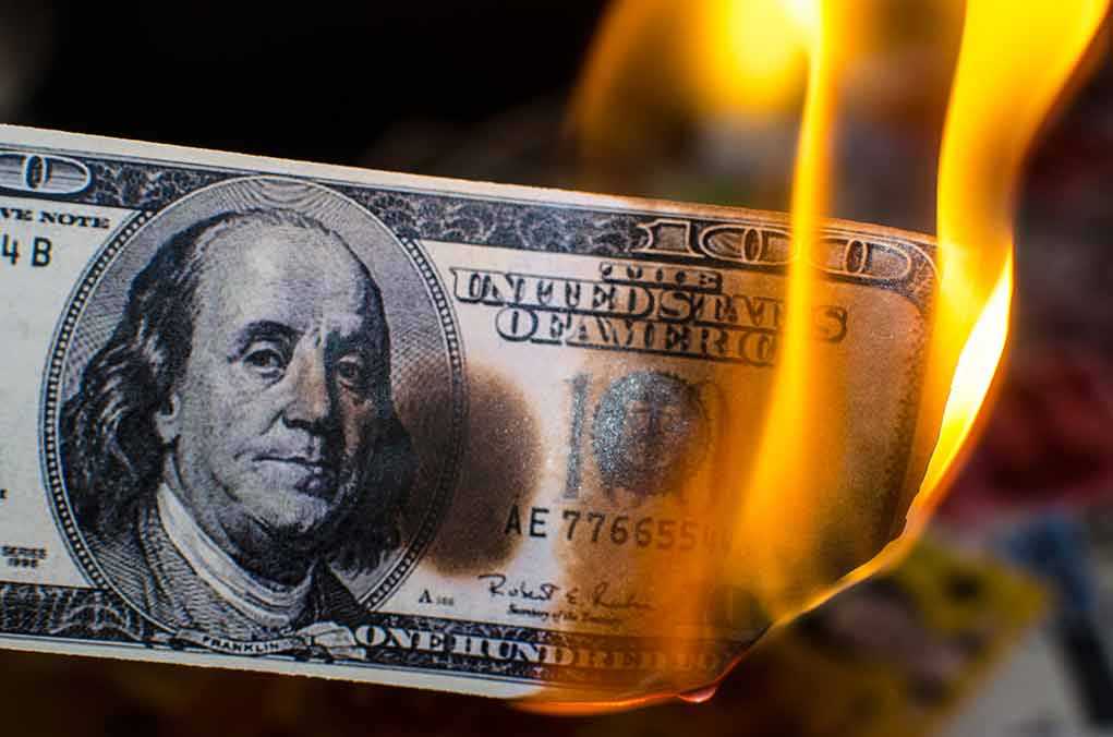 785880961 featured image Hundred dollar bill burning with orange flames
