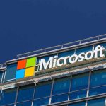 Microsoft’s $298M AI Gamble Shocks Industry Microsoft logo on a modern corporate building against a blue sky