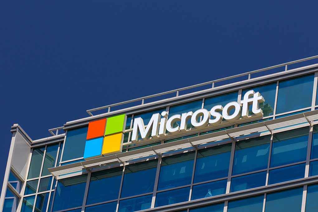 shutterstock_192614108.jpg Microsoft logo on a modern corporate building against a blue sky