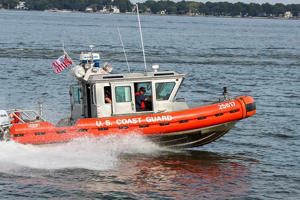 Coast Guard boat speeding on the water