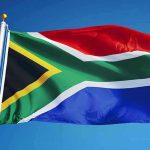 US Report SLAMS South Africa: Shocking Abuse Exposed South African flag waving against blue sky