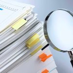 Bombshell Classified Records Report – Biden’s Big Skip Stack of documents with a magnifying glass beside it