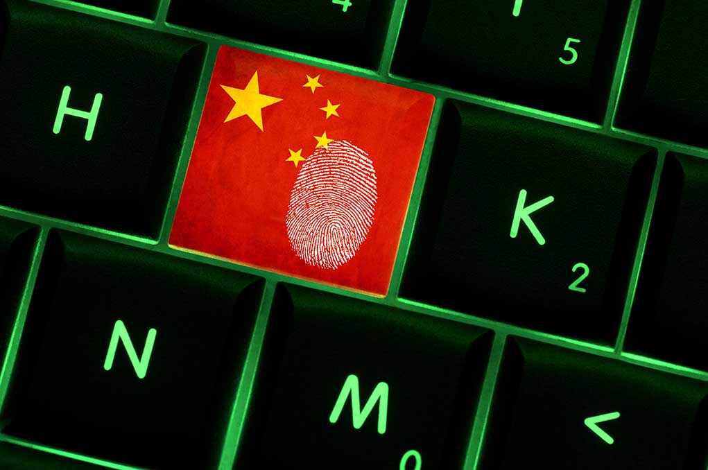 Close-up of a keyboard key featuring the Chinese flag and a fingerprint