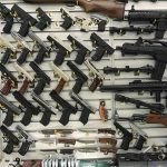 School Shooting Plot THWARTED, 23 Guns Found! Wall display with handguns and rifles for sale.