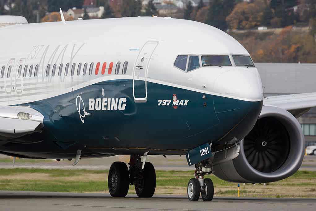 1854534454 Boeing 737 MAX airplane on runway.