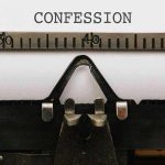 Typewriter typing the word confession on paper