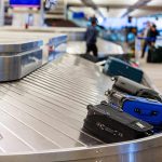 Drone Swarms SHUT DOWN Major Airports AGAIN! Luggage on a conveyor belt at an airport baggage claim area