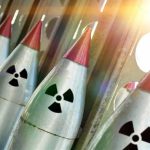 Nuclear Agency COLLAPSES — 80% Workforce FURLOUGHED! Line of nuclear missiles with radiation hazard signs.