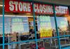 Store closing sale with going out of business signs.