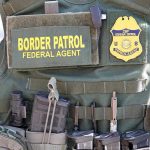$10K Bounties: Cartels Hunting ICE Agents Border Patrol vest with gear and communication equipment.