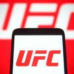 UFC Champ GUNNED DOWN! UFC logo on phone screen and background.