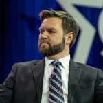 VANCE BLASTS Massie — GOP Loyalty Questioned Man in a suit with a thoughtful expression.