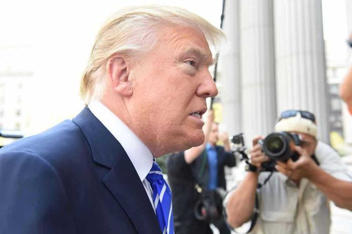 307005065 Man in suit with photographers in background.