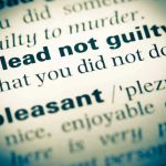 Comey BEGS Judge – Issues Desperate Plea plead not guilty highlighted in a dictionary.