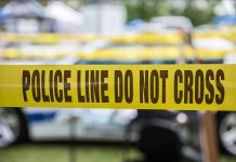 Found Dead With 20 Stab Wounds — Suicide Ruling? Yellow police line tape with Do Not Cross.