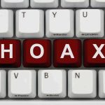 Halftime Hoax FOOLS THOUSANDS – Internet Chaos! Close-up of a computer keyboard with the word HOAX spelled out in red keys
