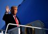 Trump Ends ANOTHER War – Nobody Knew About A political figure waving while standing on the steps of an aircraft