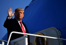 Trump Ends ANOTHER War – Nobody Knew About A political figure waving while standing on the steps of an aircraft