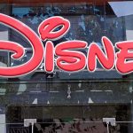 ANOTHER Disney Death – Tragedy Strikes AGAIN! Bright red Disney logo displayed on a storefront window