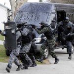 BLOODBATH: Police Gun Down 132 Gang Members! SWAT team members in tactical gear responding to a situation