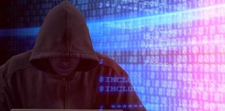 Person in hoodie using laptop surrounded by digital code