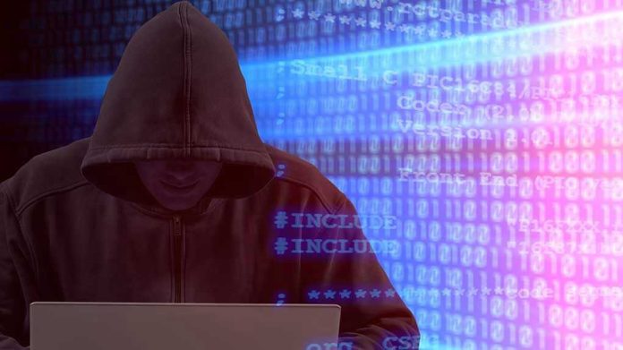 Person in hoodie using laptop surrounded by digital code