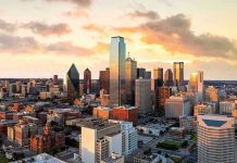 State SENDS Warning – Don’t Come Here! City skyline at sunset with modern skyscrapers.