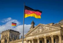 Blood-Soaked Swastikas Stun German City German flags at the Reichstag building in Berlin.