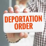 Loyal Trump Worker DEPORTED — ICE Scrambles! Hand holding sign with Deportation Order text.