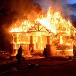 MASSIVE Firestorm Engulfs Town – 170 Homes Evacuated House engulfed in flames with firefighters present.