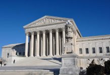 Millions At Risk: SCOTUS Battle Erupts The Supreme Court building with large columns and a clear blue sky