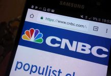 Trump UNLEASHES Wild Attack – SLAMS TV Host! Close-up of a smartphone displaying the CNBC website