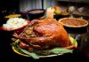 Hidden Truth Behind Dropping Thanksgiving Prices—Not What You Think! A beautifully roasted turkey on a festive table surrounded by side dishes and decorations