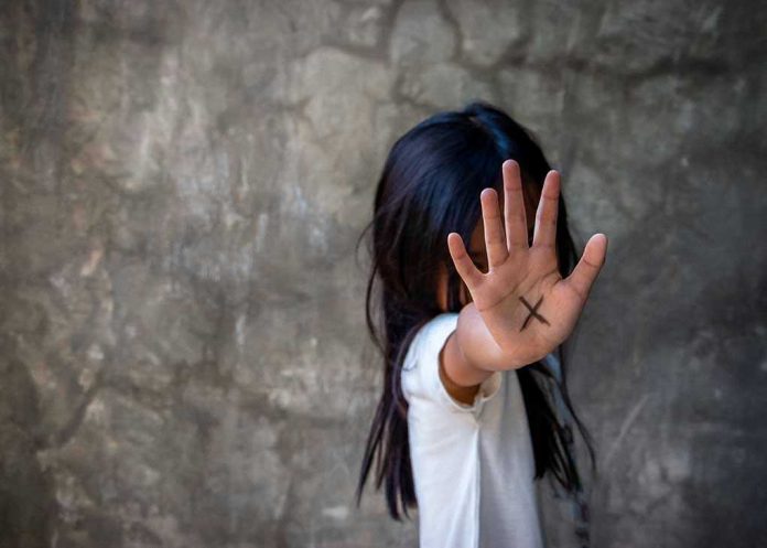 1090916351 Person with an X on their palm.