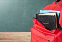 Transgender Instructor PUNISHES Christian Student Red backpack with a Bible and books inside.
