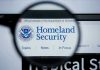 Major Immigration Sweep Hits New Orleans Magnifying glass showing Homeland Security website.
