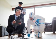 Blood-Soaked Rug SHOCKS Jurors Forensic team examining evidence at a crime scene indoors.