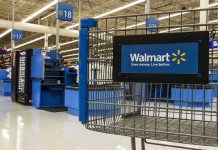Black Friday DEATH: Corporate Greed Exposed Walmart shopping cart inside store near checkout aisle