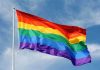 LGBTQ “Indoctrination” Allegations SHAKE Netflix A rainbow flag waving against a blue sky