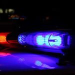 Officer Accused: Pregnant Witness’s Death STAGED? Close-up of police lights flashing in blue and red at night