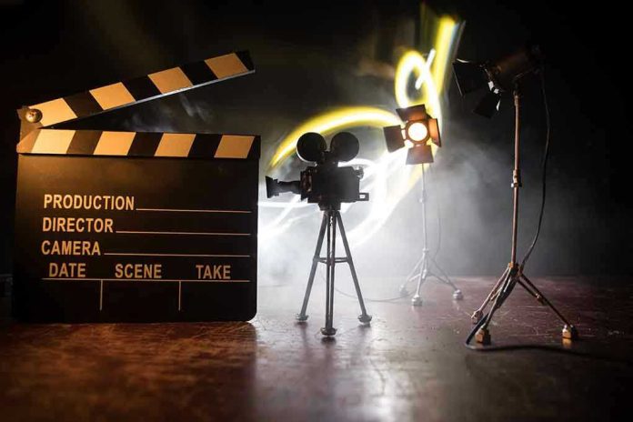 1727563630 Film set with clapperboard, camera, and lighting.