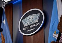 Pentagon PURGE Targets Female Military Leaders The Pentagon emblem between two flags.