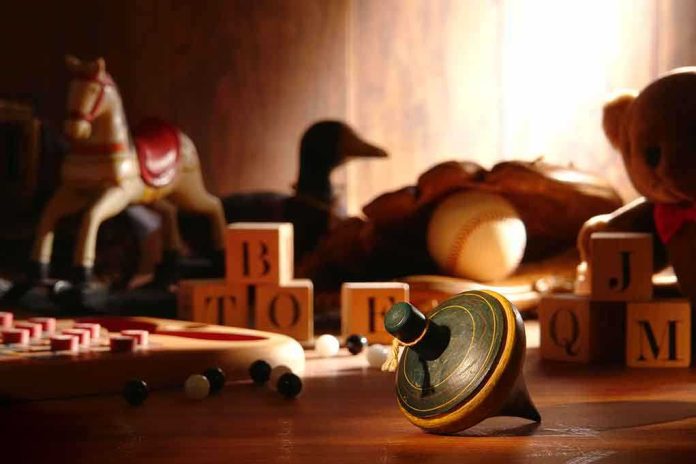 A wooden spinning top surrounded by vintage toys and colorful blocks