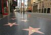Hollywood Walk of Fame stars on sidewalk.