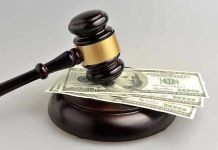 Colorado Democrats ERASE Prostitution Laws Gavel resting on hundred-dollar bills.