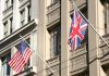 American and British flags displayed on a building