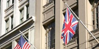 American and British flags displayed on a building