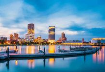 City skyline with waterfront at twilight.