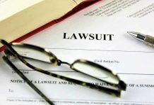 House GOP BURIED Plaque — Officers SUE! Lawsuit document with glasses, pen, and book.