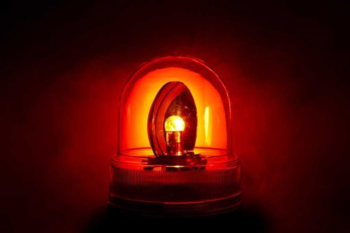 shutterstock_71029123.jpg Red emergency light illuminated against a dark background